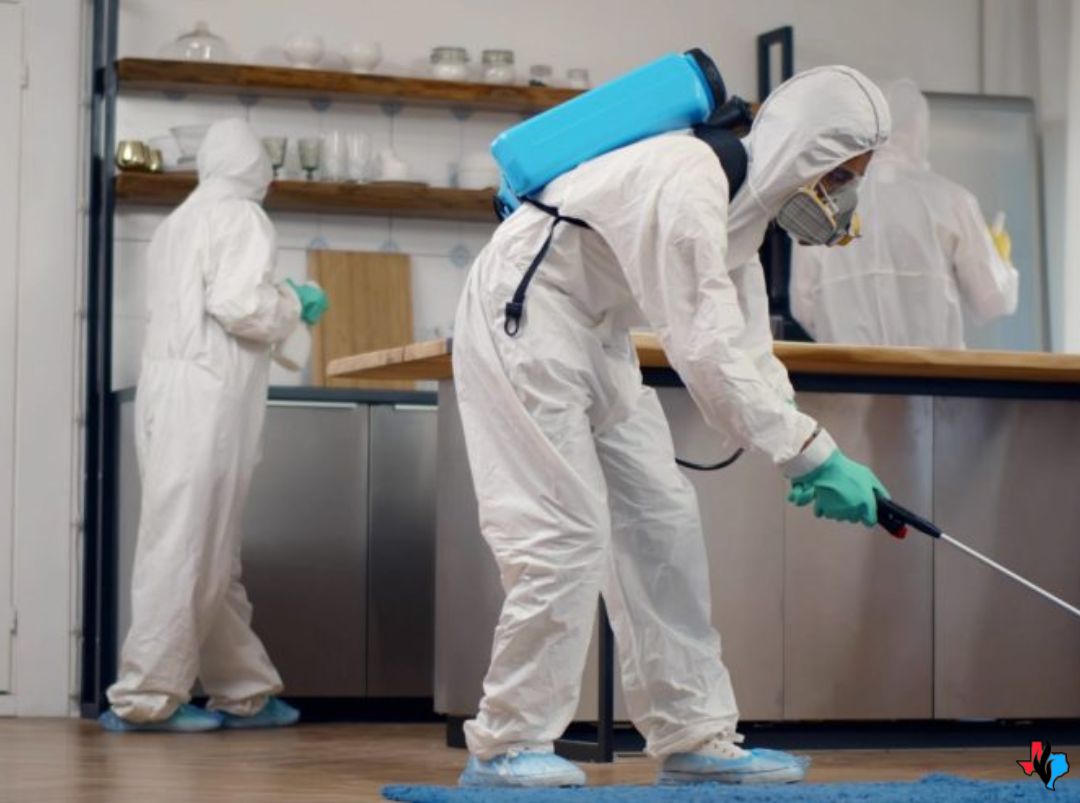 Biohazard Clean-Up and Restoration in Cypress, TX – Technicians in full hazmat suits disinfecting a modern kitchen using sprayers and protective gear. Precision Restoration provides 24/7 biohazard cleanup services in Cypress, TX for trauma, death, and medical waste incidents.