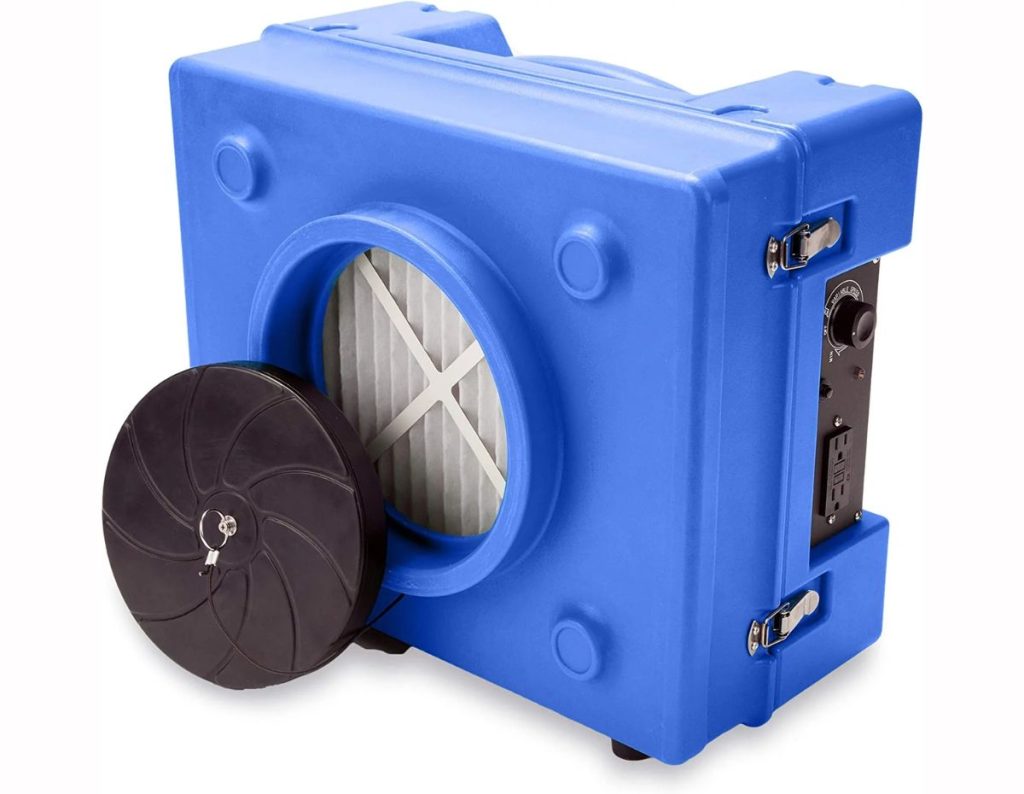 Blue HEPA air scrubber with carbon filters used for removing smoke odor in Houston TX after fire damage.